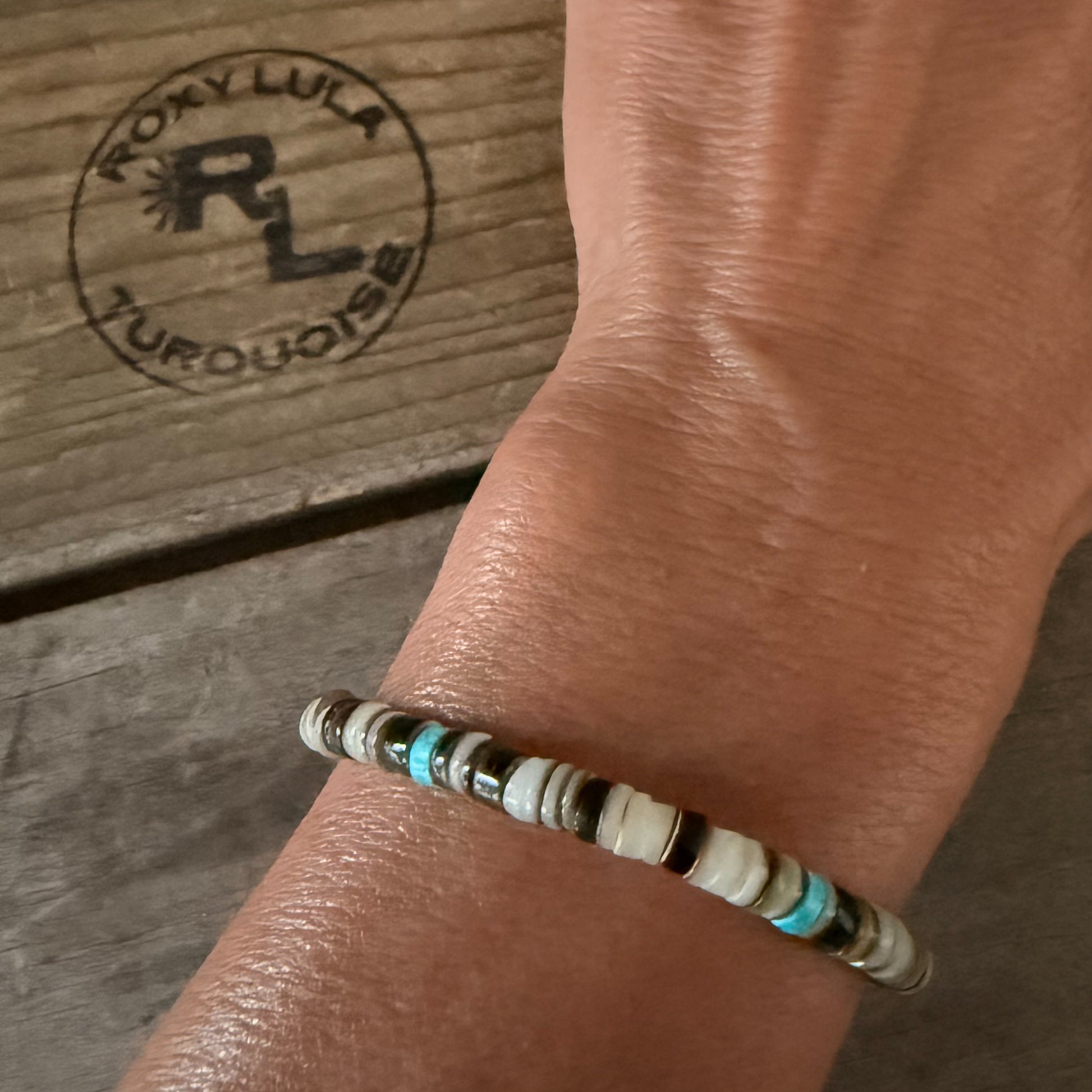 Howlite, mussel shell, and olive shell stretch stacking bracelet