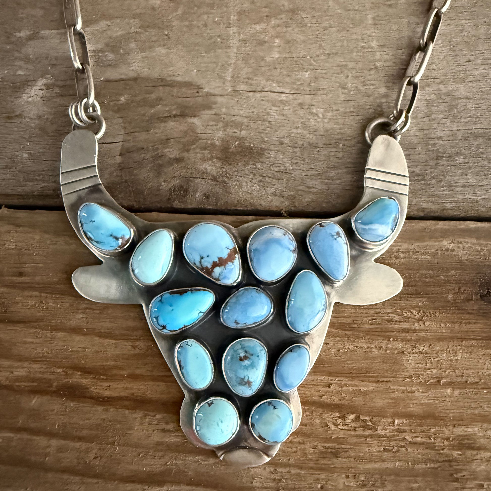 Authentic Native American Handmade Sterling Silver and Golden Hills Paper Clip Cow Necklace.