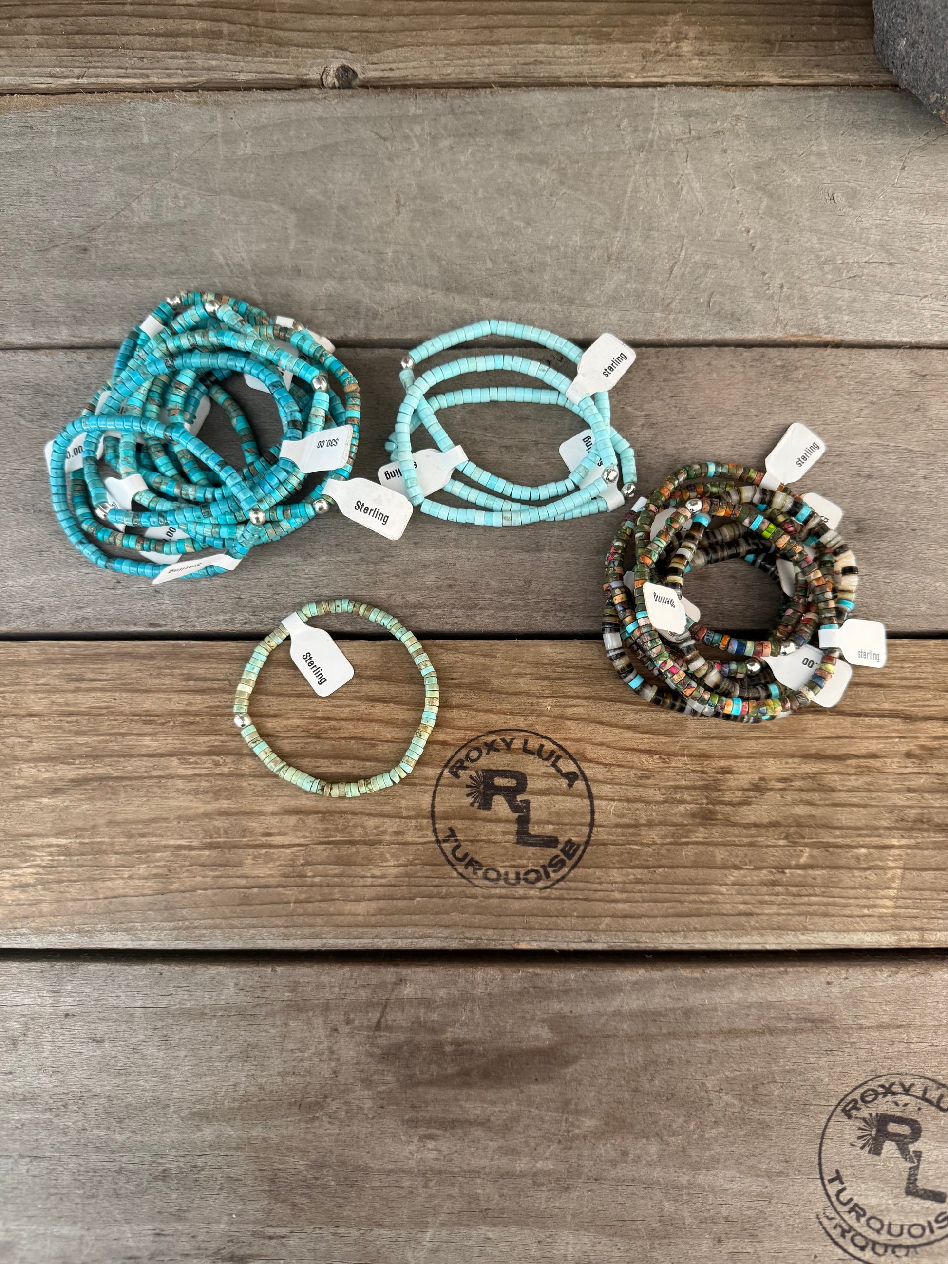 Howlite, mussel shell, and olive shell stretch stacking bracelet