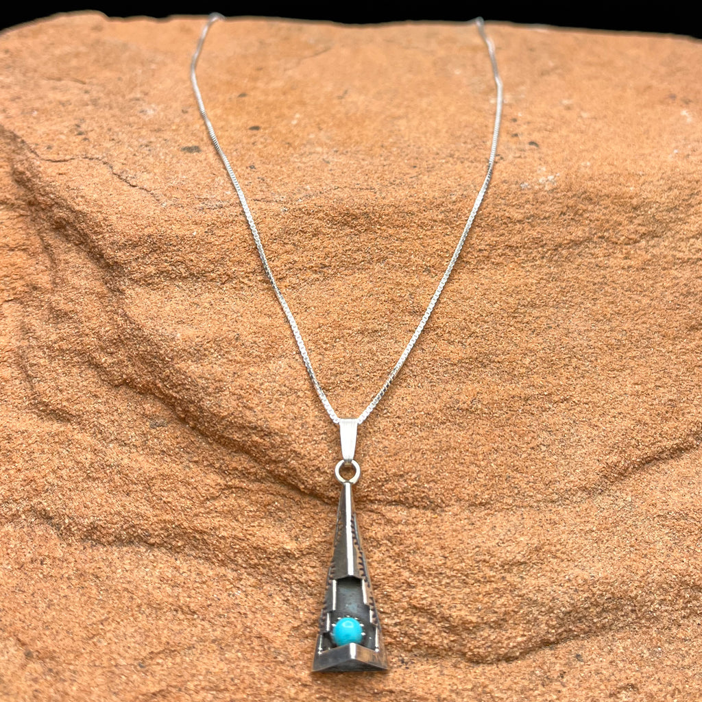 Authentic Native American Handmade Cut and Stamped Sterling Silver and Turquoise Pendant with 18” sterling silver chain necklace.